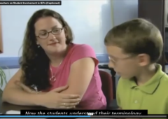 Screen grab from video featuring a teacher sitting with a young student discussion his IEP.