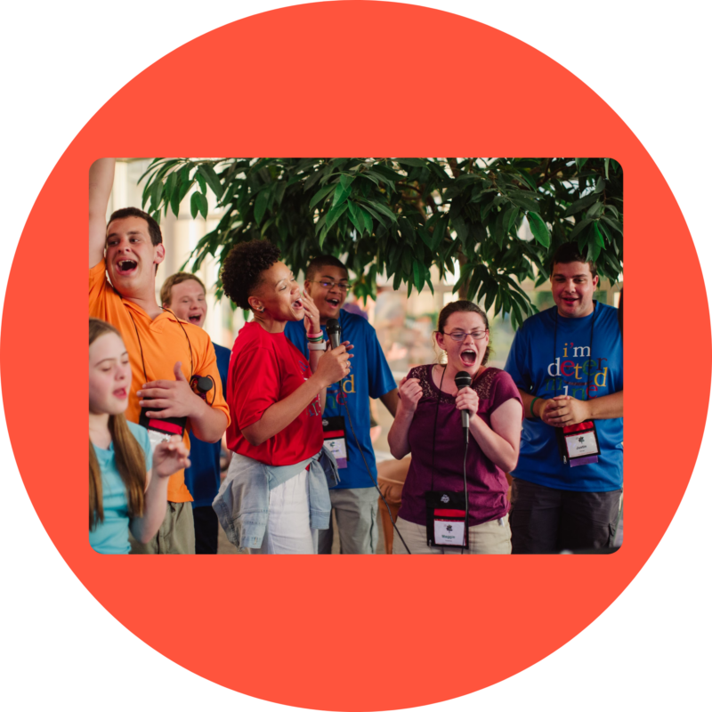 I'm Determined staff and participants share the microphone during karaoke, which took place at the Youth & Family Summit.