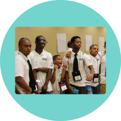 Participants at the MOVE Summit wearing matching white polos.