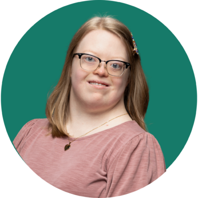 Headshot of Youth Leader, Sydney Ellis with a dark teal background