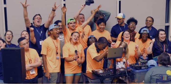 Photo of IMD Youth Leaders singing together passionately.